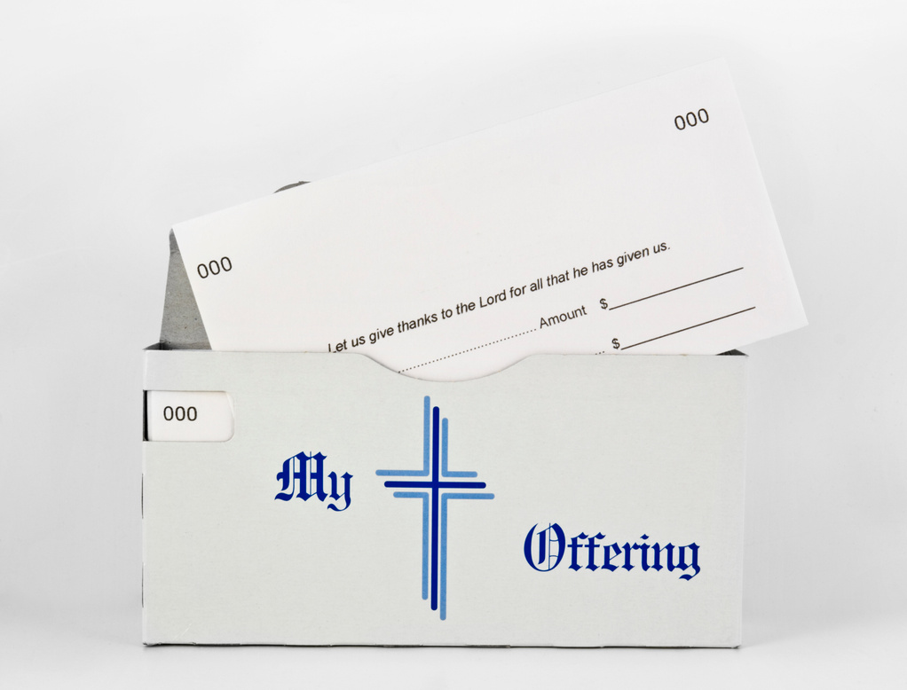 church offering envelopes - one partially out